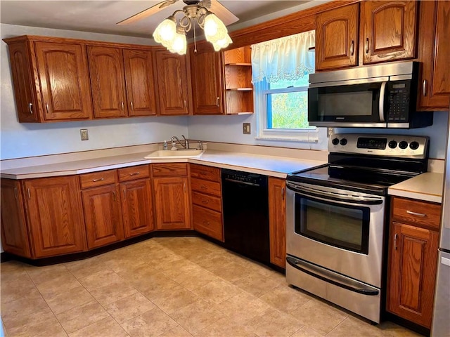 kitchen with a sink, stainless steel appliances, brown cabinets, and light countertops