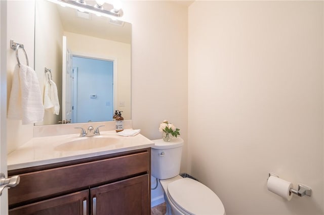 half bath with vanity and toilet