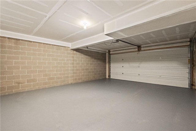 garage featuring concrete block wall