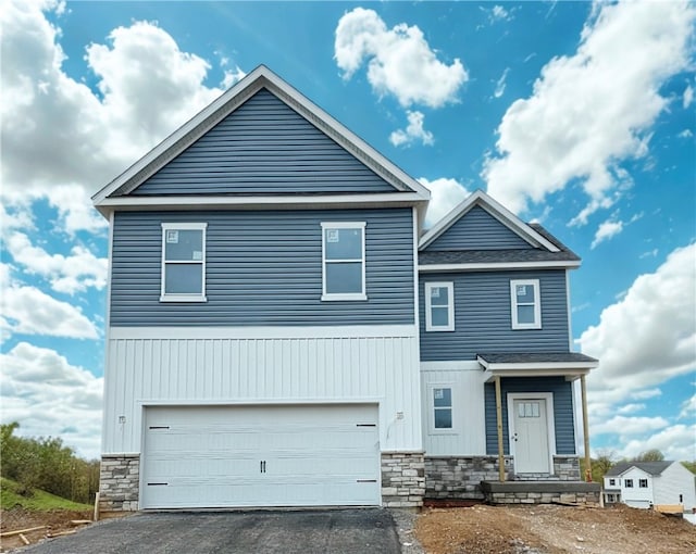 175 Shelton Place Dr, Connoquenessing Boro, PA 16033 - view of front of home featuring a garage, aphalt driveway, roof with shingles, and stone siding