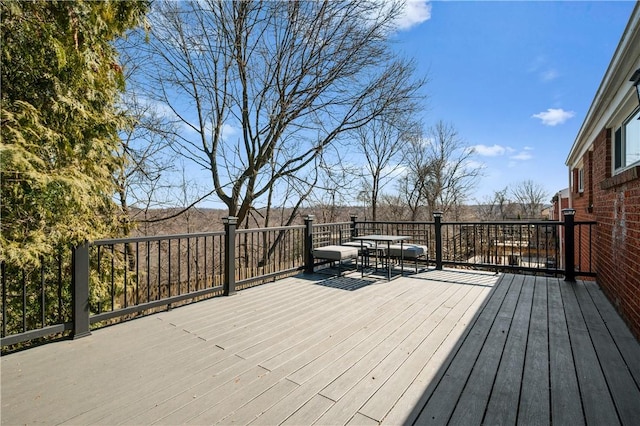 deck with outdoor dining area