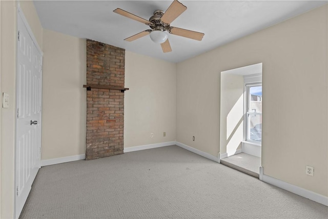 empty room with baseboards, carpet floors, and ceiling fan