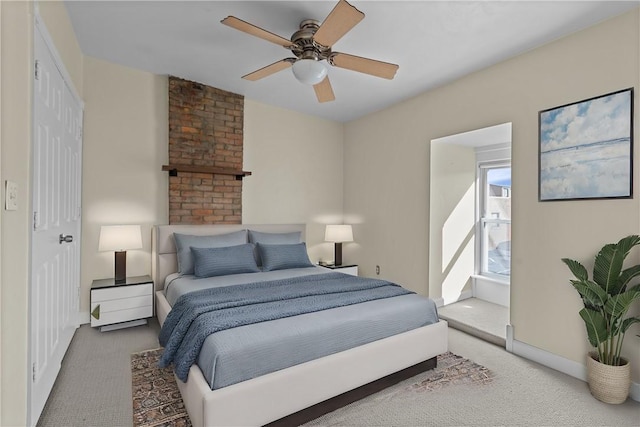 carpeted bedroom featuring baseboards and ceiling fan