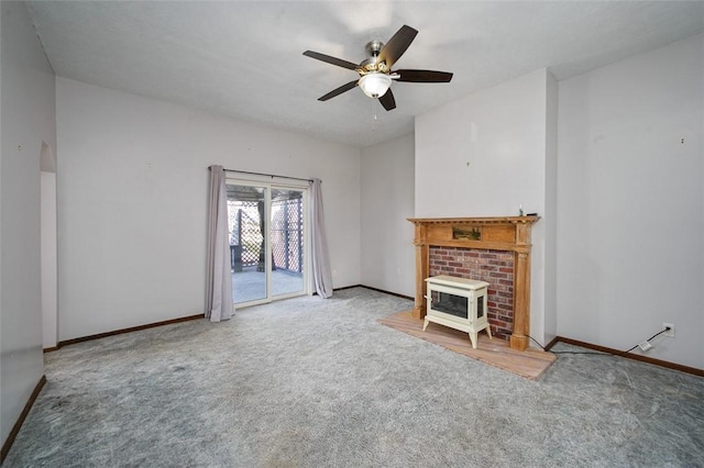 unfurnished living room with baseboards, a ceiling fan, and carpet flooring