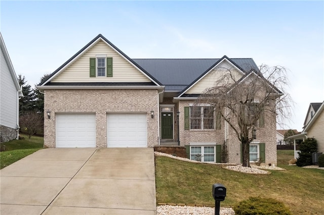 view of front of property featuring brick siding, a garage, driveway, and a front lawn