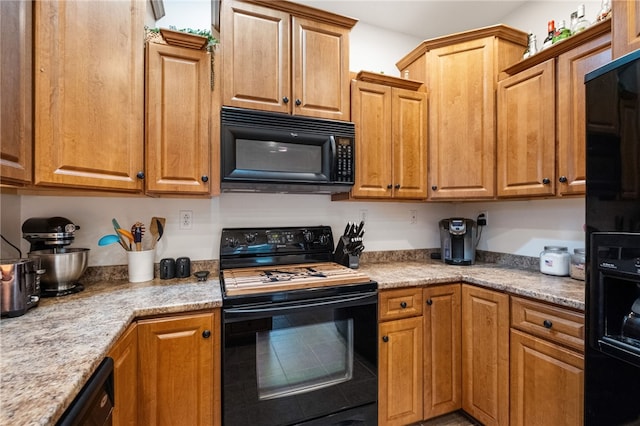 kitchen with brown cabinets and black appliances