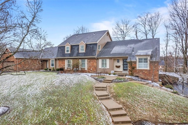 view of front of property featuring brick siding