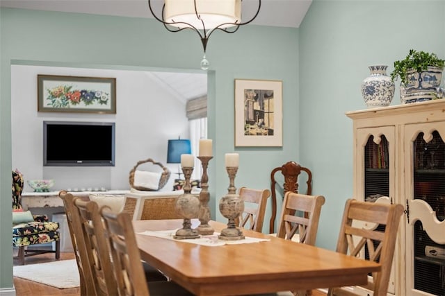 dining area with vaulted ceiling