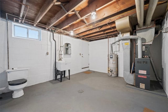 basement featuring heating unit and water heater