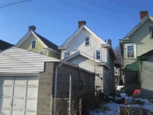 view of property exterior featuring a garage