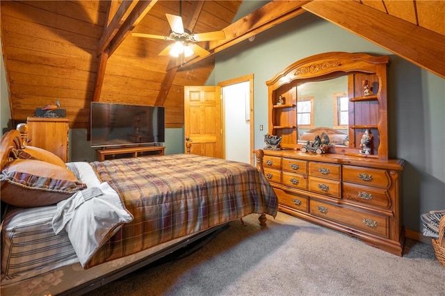 carpeted bedroom with vaulted ceiling with beams