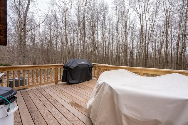 wooden deck featuring area for grilling