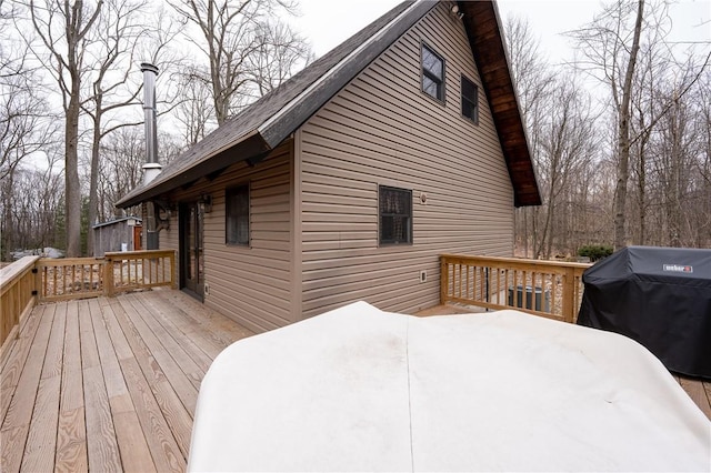 wooden deck featuring area for grilling