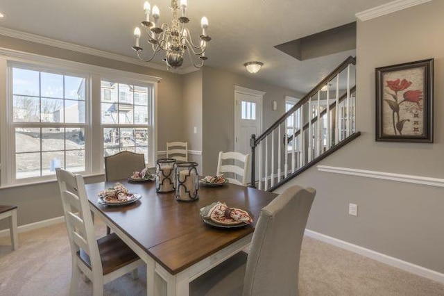 dining area with baseboards, light carpet, ornamental molding, and stairs