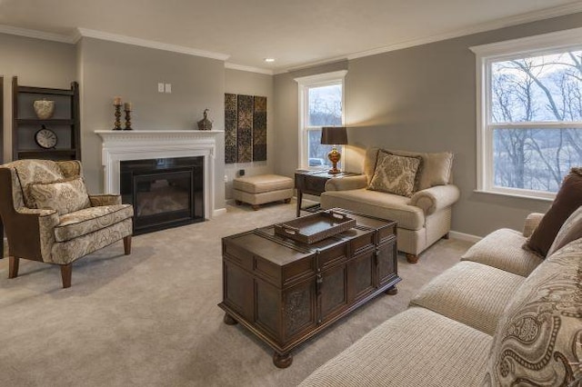 living area with baseboards, a fireplace with flush hearth, light colored carpet, and ornamental molding