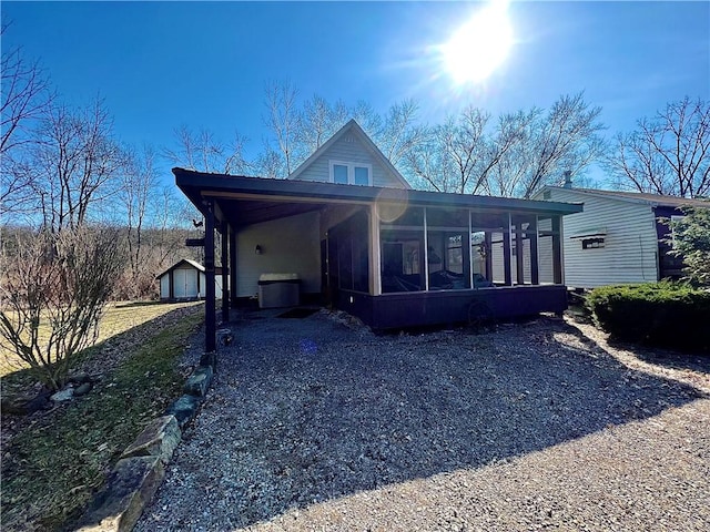 view of front facade featuring a sunroom