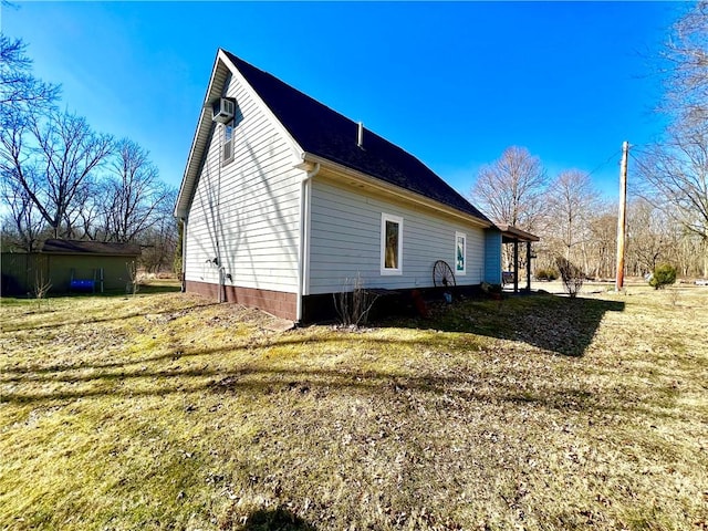 view of property exterior with a lawn