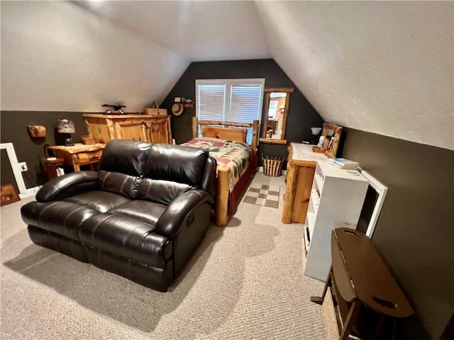 bedroom with vaulted ceiling and light carpet