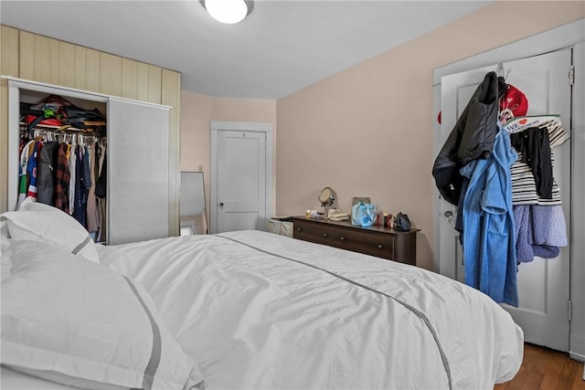 bedroom featuring a closet and wood finished floors