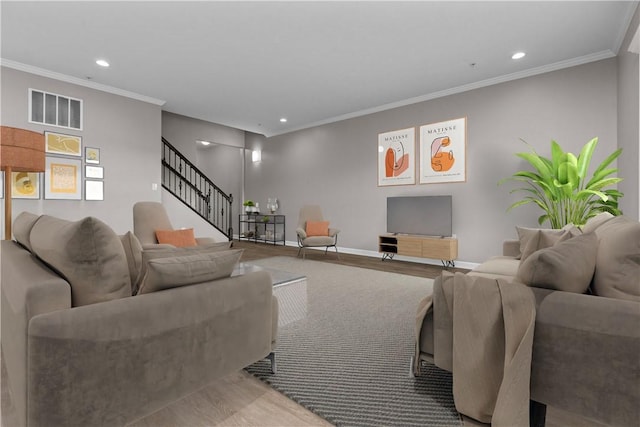 living area featuring stairway, visible vents, baseboards, recessed lighting, and crown molding