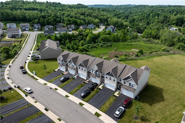 aerial view with a forest view and a residential view