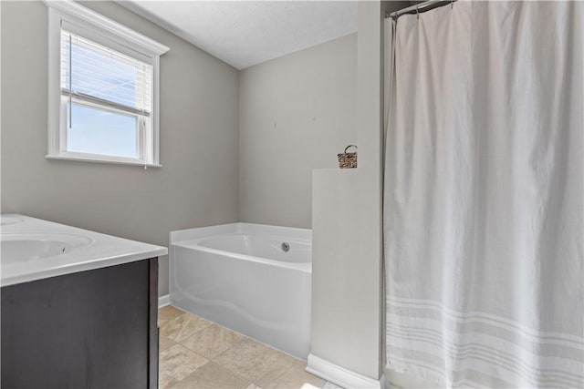 bathroom featuring a garden tub, a textured ceiling, a shower with shower curtain, tile patterned flooring, and vanity