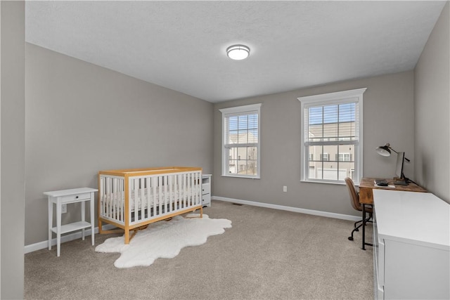 bedroom featuring carpet flooring and baseboards