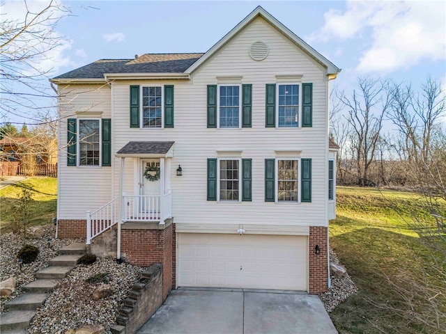 view of front of home with a garage, brick siding, concrete driveway, and a front lawn