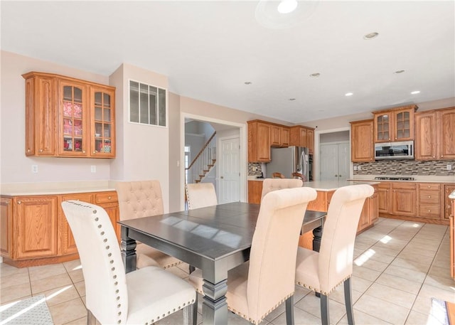 dining area with stairway, light tile patterned floors, recessed lighting, and visible vents