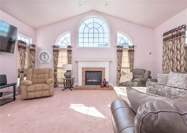 carpeted living area featuring lofted ceiling and a fireplace