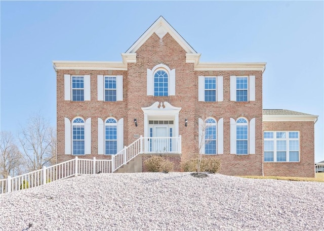 view of front of house featuring brick siding