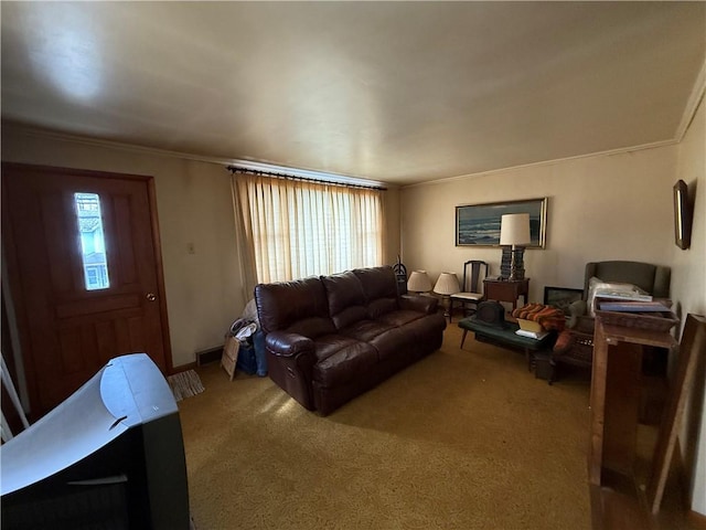 carpeted living area with visible vents and crown molding