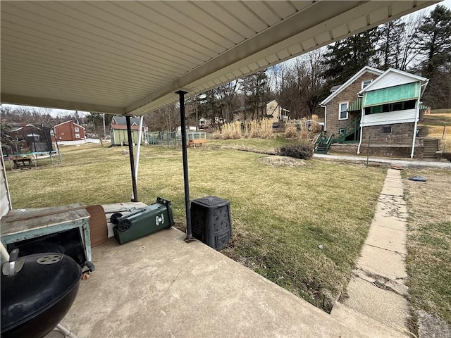 view of yard with a trampoline