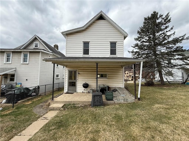 back of house with a yard, a patio, and fence