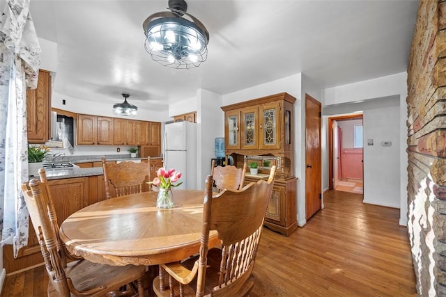 dining area featuring light wood-style floors