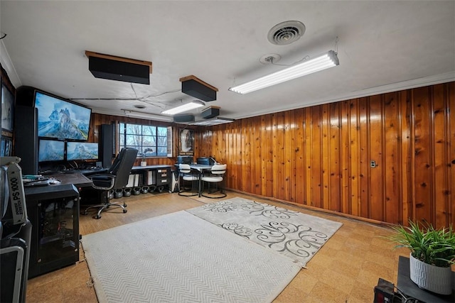 office area featuring tile patterned floors, visible vents, and wooden walls