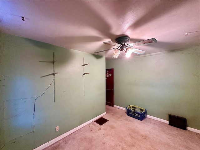 unfurnished room with baseboards and ceiling fan