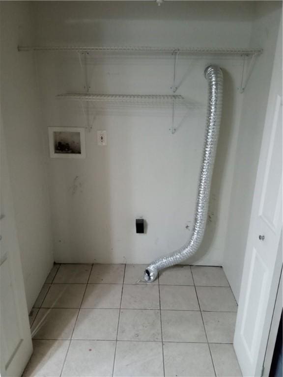 laundry room featuring washer hookup, laundry area, light tile patterned floors, and electric dryer hookup