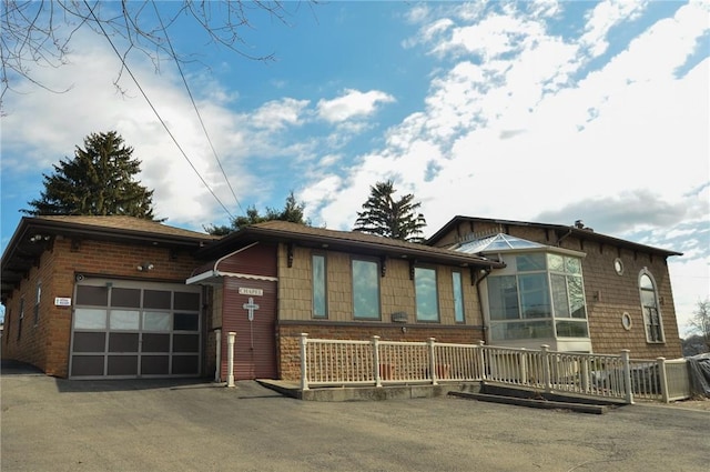 view of front of property with an attached garage and driveway