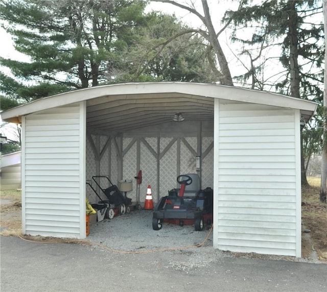 view of vehicle parking with a detached carport