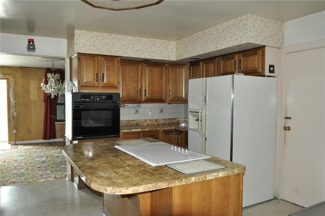 kitchen featuring a kitchen island, oven, decorative backsplash, white fridge with ice dispenser, and brown cabinetry