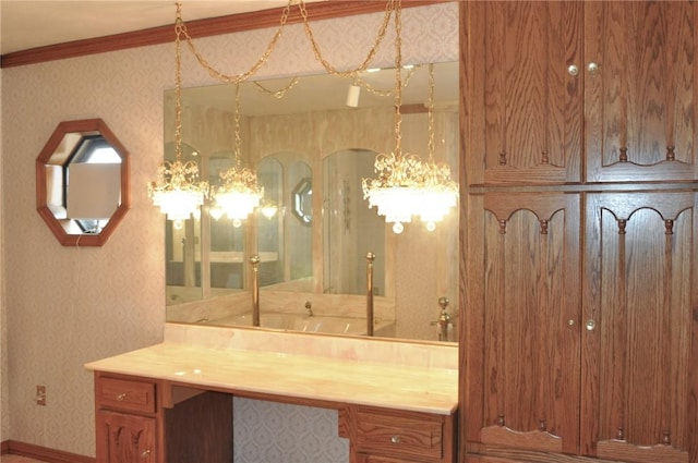 bathroom with vanity, baseboards, wallpapered walls, an inviting chandelier, and crown molding