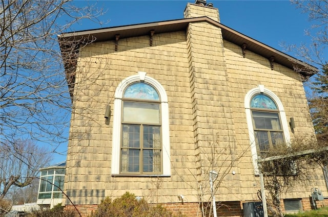view of home's exterior featuring a chimney