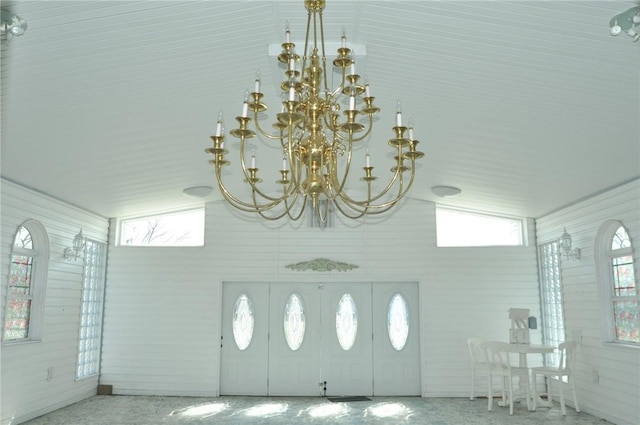 interior details featuring speckled floor and a chandelier