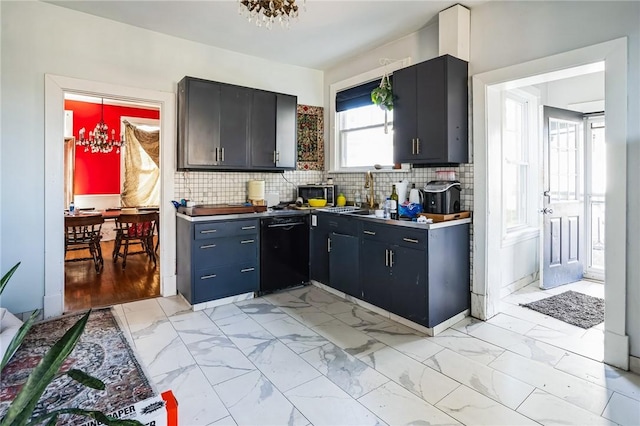 kitchen with a sink, decorative backsplash, dishwasher, a notable chandelier, and marble finish floor