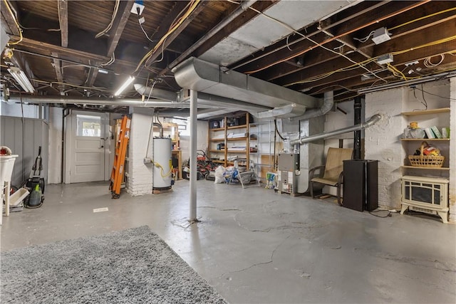 basement featuring gas water heater and heating unit