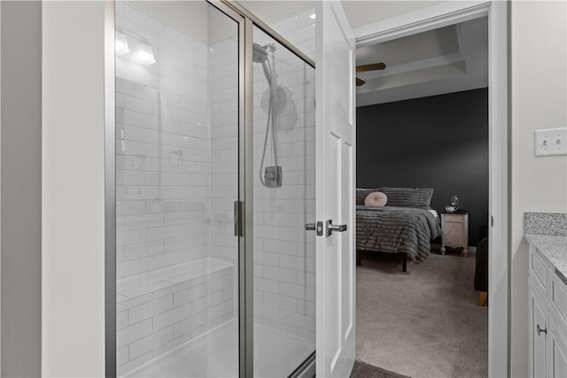 full bath featuring vanity, a shower stall, a ceiling fan, and connected bathroom