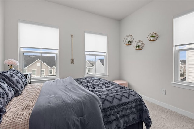 carpeted bedroom with baseboards