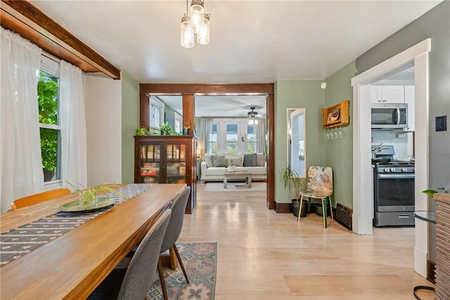 dining area featuring light wood finished floors