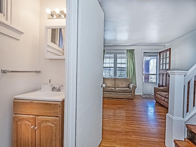 interior space with vanity and wood finished floors